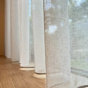 S-Fold Sheer Curtains sitting above the floor